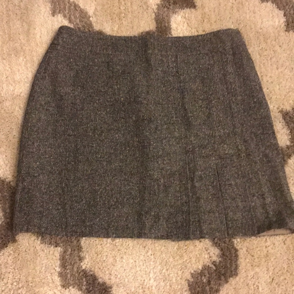 Mini skirt with side pleats.